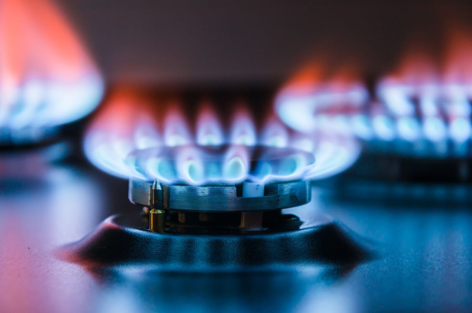 Gas burners ignited with blue flame.
